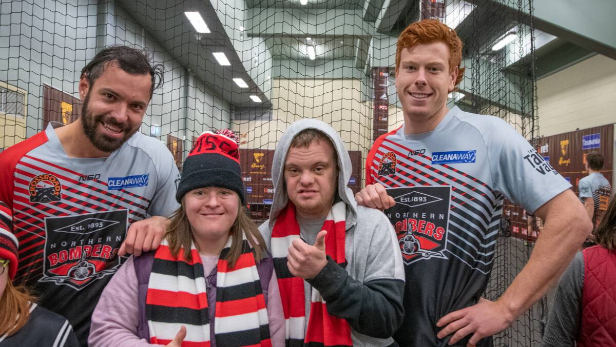 St Kilda supporters at their St Kilda Supporters Group kids' downs syndrome day and North Launceston footballers Brayden Van Buuren and Thomas Donnelly with Chloe Hanson and Joel Ockerby Pictures: Paul Scambler
