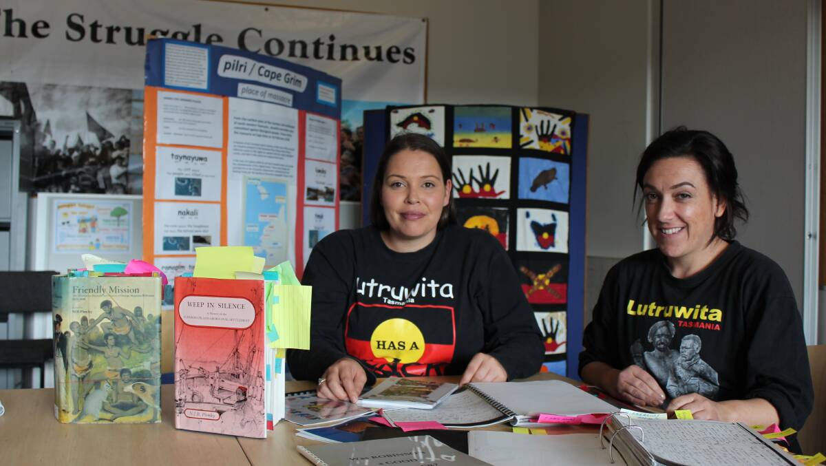 PRESERVING LANGUAGE: Language researcher Rosetta Thomas and youth worker Daisy Allan with manuscripts. Picture: File