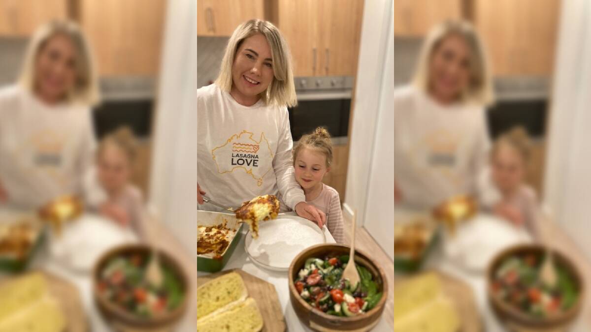 DISHING OUT LOVE: Lasagna Love regional director Stacy Klousia and daughter Eleanor baking the family favourite. Picture: supplied