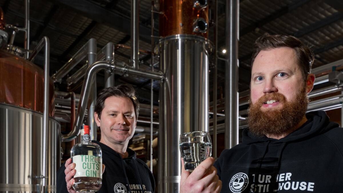 SPIRITED: Founder Justin Turner and distiller Brett Coulson with the award-winning Three Cuts Distiller's Release Gin. Picture: File 