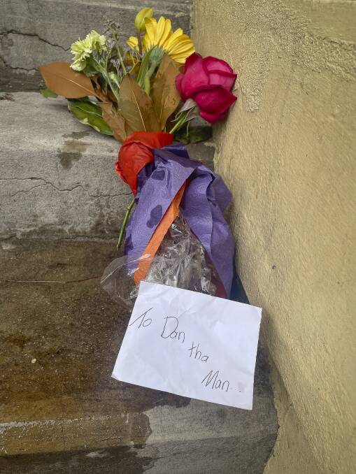 Flowers laid outside Milton Hall. 