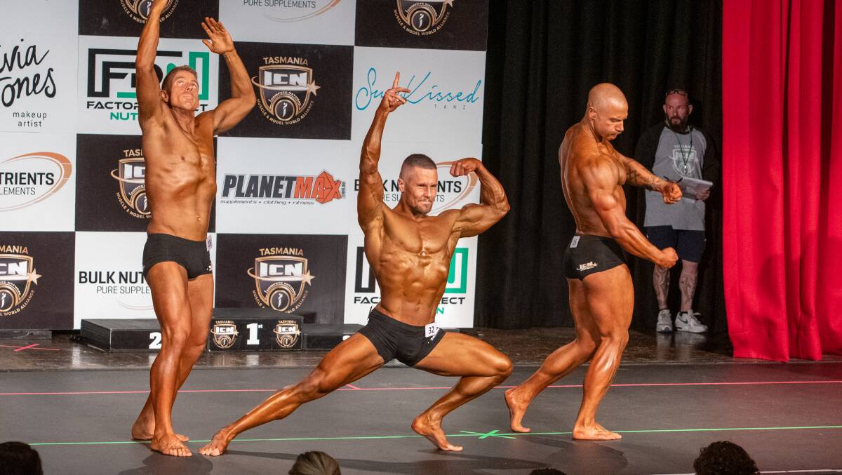GUNS OF STEEL: Stuart Clark, Sam McCall and Junior Monks strike a pose in the men's classic physique open. Pictures: Paul Scambler