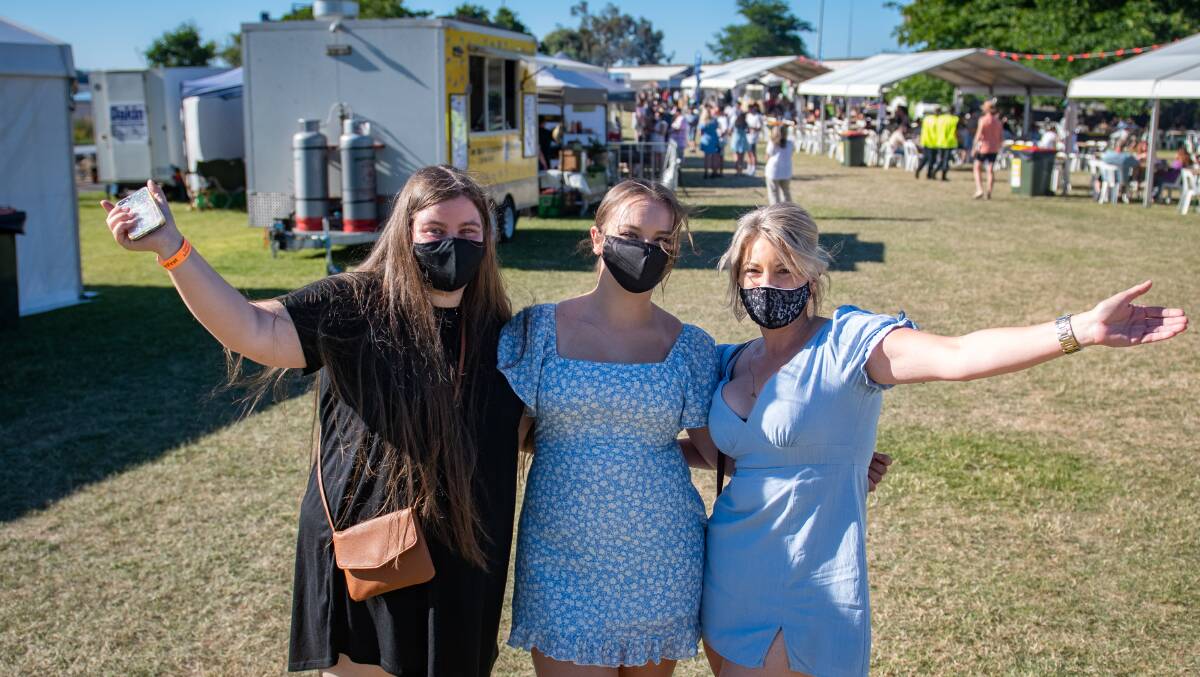 CHEERS: Bella Smith, Remi Smith and Kristy Smith say goodbye to 2021 at BeerFest. Picture: Paul Scambler