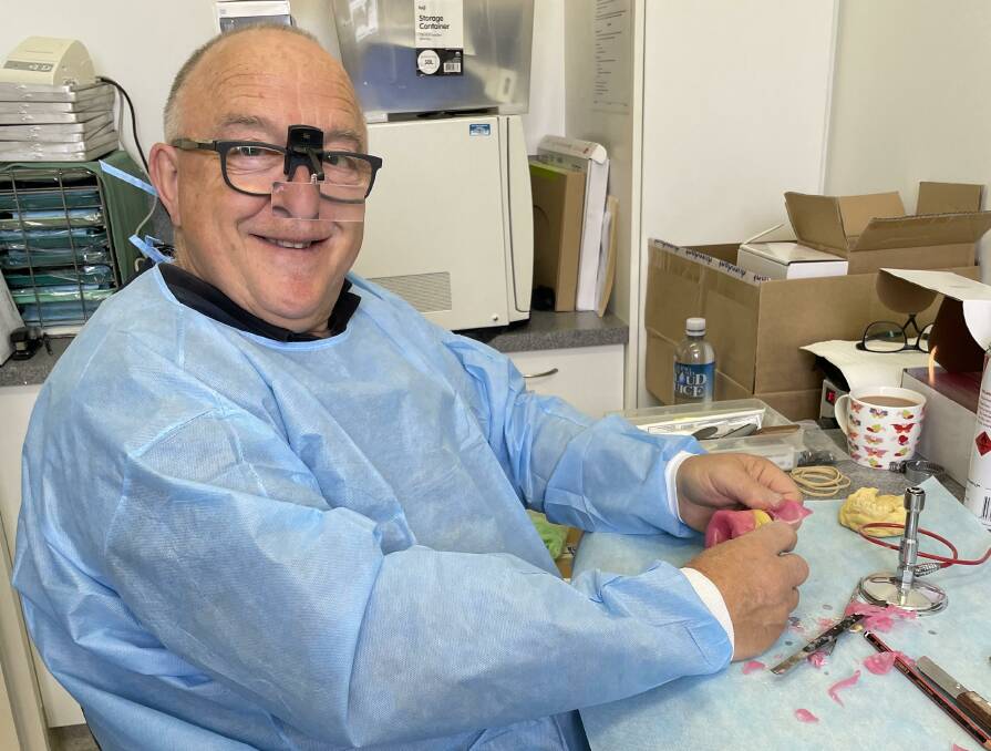 SMILE: Russell Brownlie working in on King Island in the dental lab funded by the RFDS. Picture: Meg Oliver