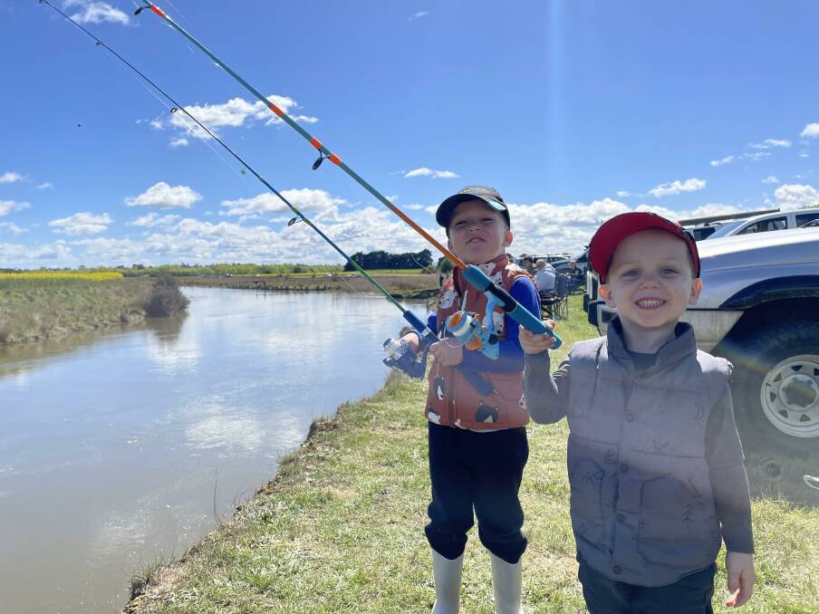 GUPPIES: Four-year-old Phoenix Lockhart and brother five-year-old Parker from Youngtown attend the Hydro Tasmania, Cressy Community Trout Expo at Brumbys Creek. Picture: Andrew Chounding 