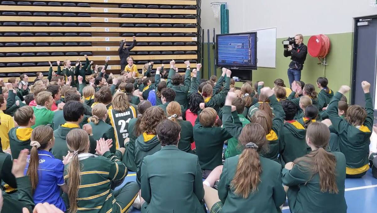 GOLD: Students at Ariarne Titmus' old school St Patrick's College celebrate the 20-year-old winning her first gold medal. Picture: Supplied