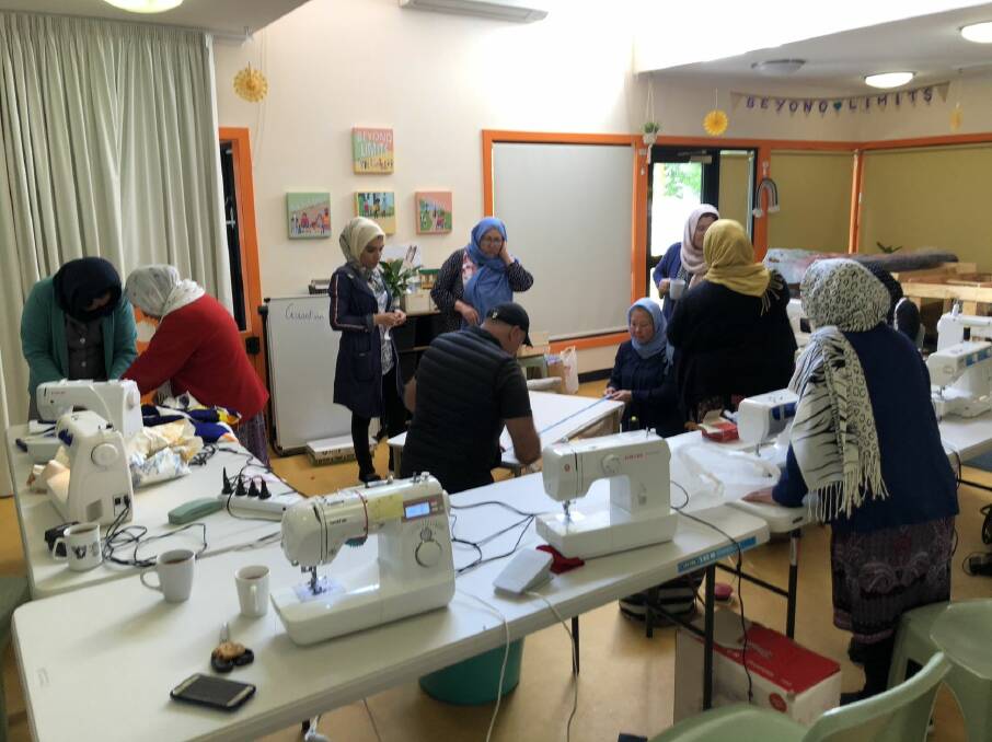 BUFF: Asiyeh Heidari oversees the sewing group at the Migrant Resource Centre North. Picture: supplied 