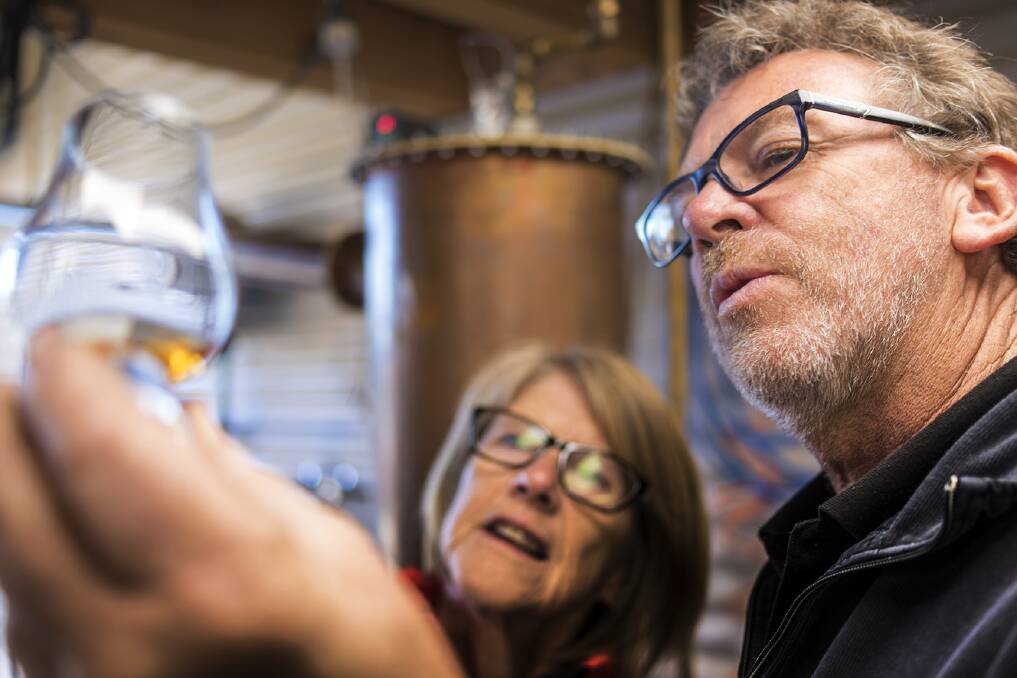 A GOOD DROP: Mathew Cooper and his wife Julie from Fannys Bay Distillery have created Tasmania's first 100 percent wheat whisky. Picture: Rob Burnett 