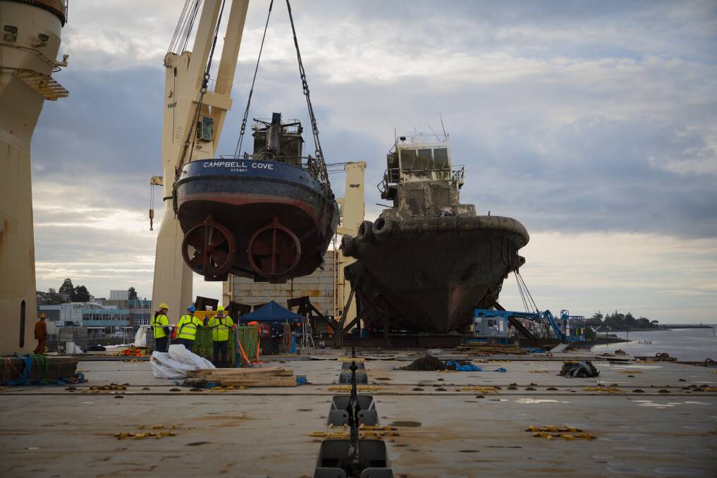 Salvage complete: The Campbell Cove being lifted onto the AAL Melbourne. Picture: TasPorts.