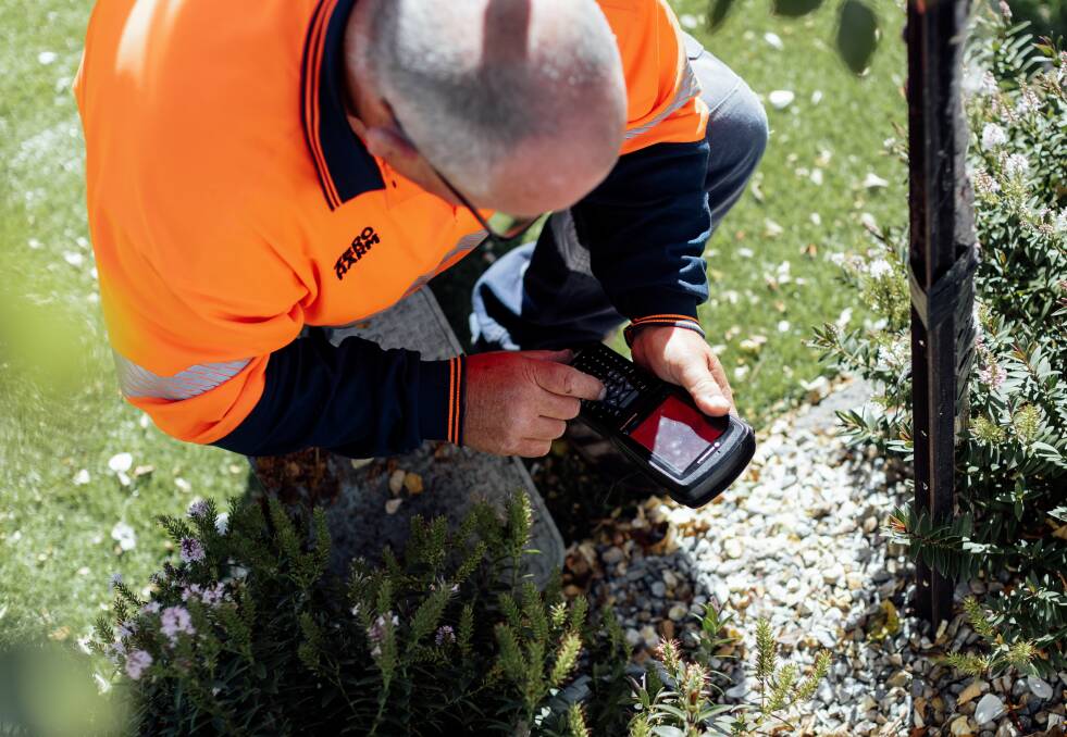 ON THE JOB: TasWater is reminding customers to keep their water meters clear of hazards so they are easily accessible for meter readers. Picture: Supplied.