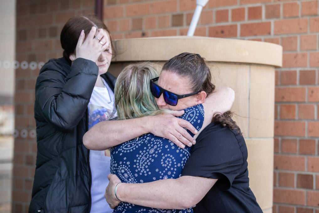 Kylie Stewart and Miranda Dodt embrace following the press conference in Devonport. Picture by Eve Woodhouse