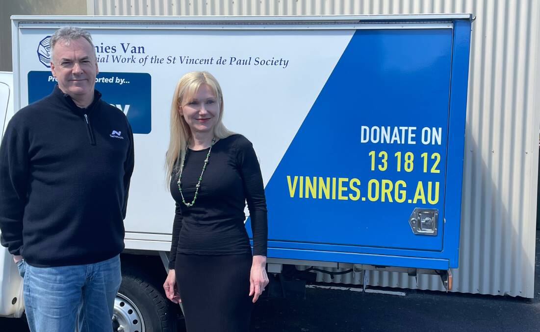GENEROSITY: TasNetworks chief executive Sean McGoldrick and St Vincent de Paul Society Tasmania chief executive Lara Alexander with a Vinnies food van. Picture: Nikita McGuire