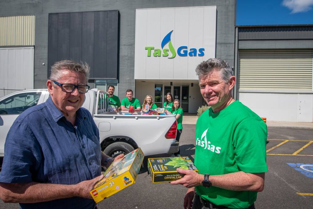 Vinnie's Eric Welsh and Ben Charles from Tas Gas with Tas Gas employees Ian Avico, Will Smyth, Lauren Warren, Jenna James and Karen Hopkins. Picture by Paul Scambler