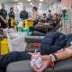 SAVING LIVES: Tasmania Police Launceston recruit Ebony Manion donates blood, with fellow officers for the Emergency Services Challenge at Lifeblood. Picture: Paul Scambler