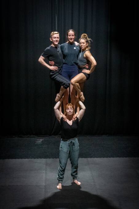 BALANCE ACT : Circas Peepshow's Freyja Wild supports Andrew Sumner, Billie Wilson-Coffey, and Rhiannon Cave-Walker. Picture: Paul Scambler 
