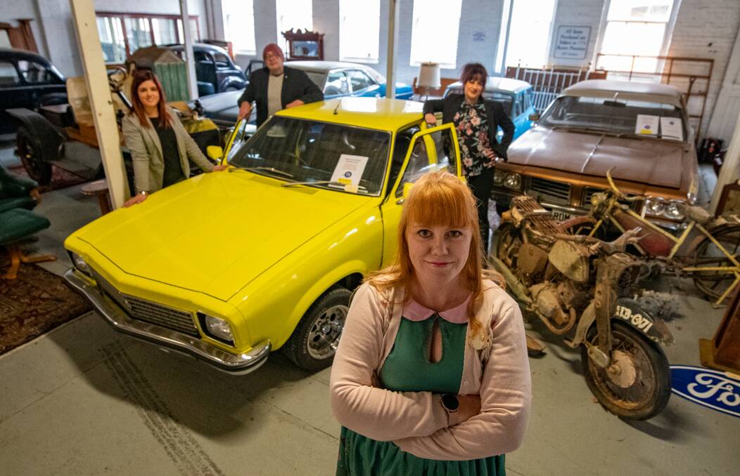 Simone Johns in front of a Torana with Sammy Rumbel, Chris Flood and Nadia Caccioppola of Tulloch Auctions. Picture: Paul Scambler