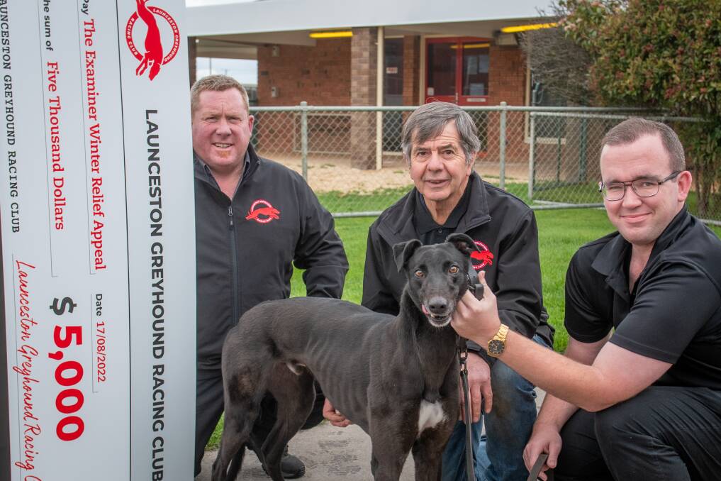 DOG'S DONATION: Ben Clark, John Newson and Brennan Ryan, with Shadow who are giving a $5000 donation to The Examiner Winter Relief. Picture: Paul Scambler