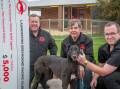 DOG'S DONATION: Ben Clark, John Newson and Brennan Ryan, with Shadow who are giving a $5000 donation to The Examiner Winter Relief. Picture: Paul Scambler