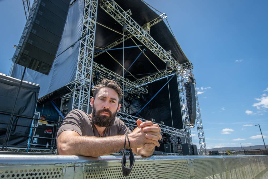 FINAL PREPARATIONS: Jesse Higgs, organiser of Party in the Apocalypse oversees the stage setting up at Invermay Park. Picture: Paul Scambler