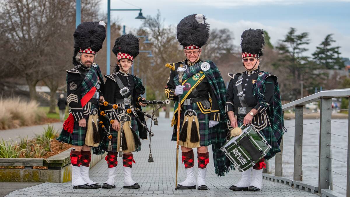 PIPES: Pipe Major David Potter and his son, Thomas Potter, with band co-ordinator Peter Scales and retired Tenor Drummer Colin Potter. Picture: Paul Scambler 