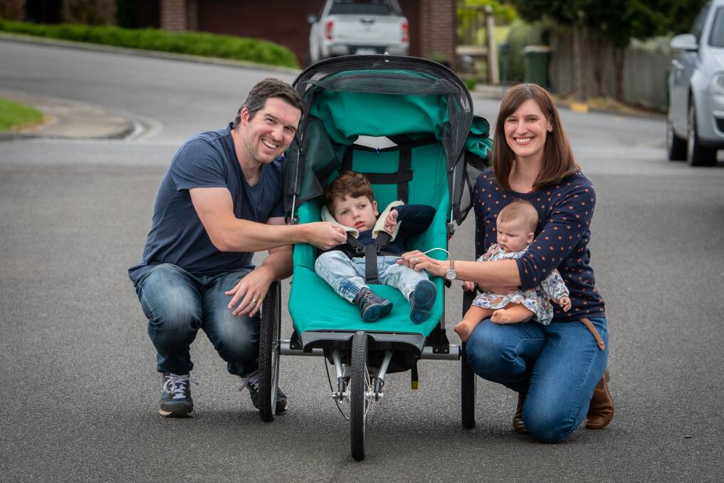 INSPIRATIONAL: Lucas Parry and his wife Rachael Parry, with their son Robbie, and three-month-old daughter Elizabeth. Picture: Paul Scambler