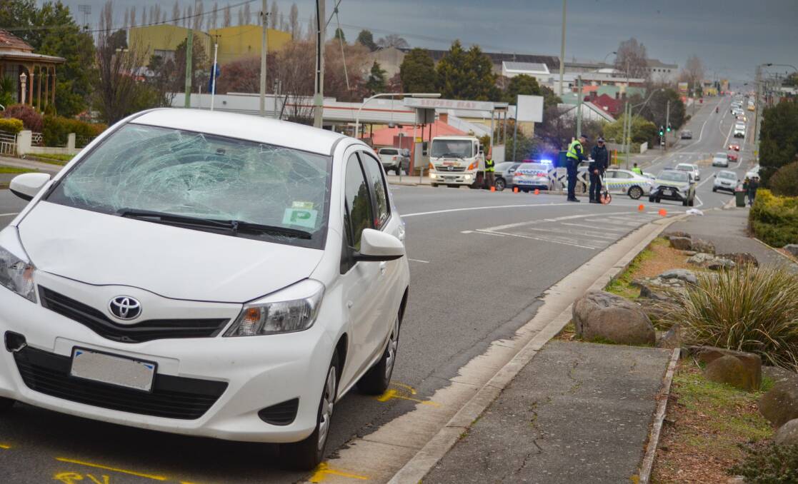 AFTERMATH: a white 2014 Toyota Yaris parked on George Town Road, at Mowbray, after colliding with a pedestrian. Picture: Luke Miller