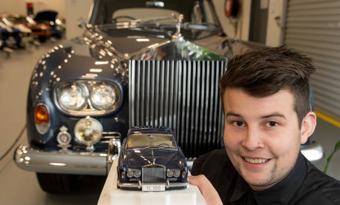 REPLICA: National Automobile Museum of Tasmania assistant manager Dylan Costello in front of a 1965 Rolls-Royce Silver Cloud III. Picture: Phillip Biggs