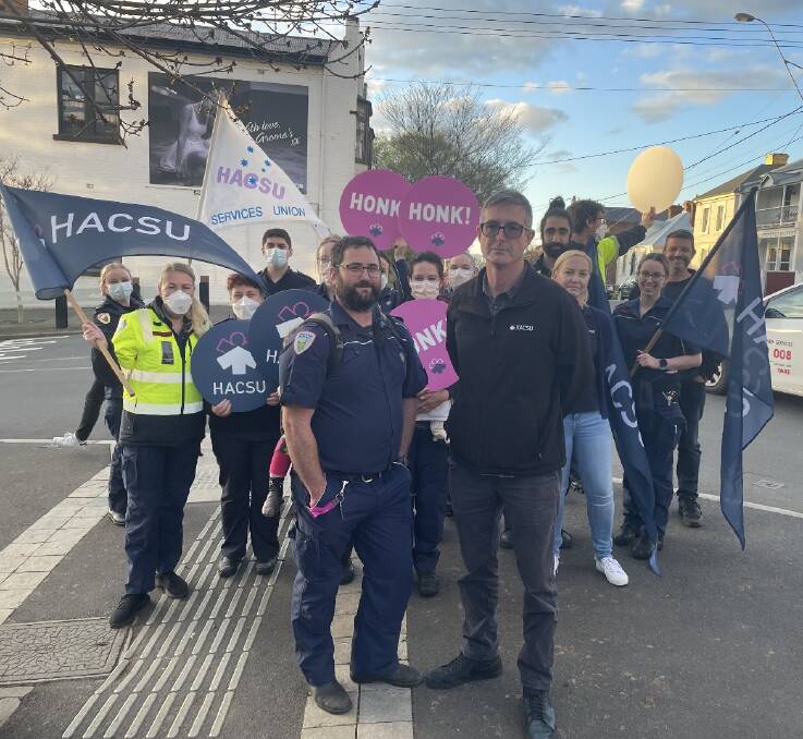 Launceston Ambulance sub-branch vice president James Watkins with Health and Community Services Union Assistant State Secretary Lucas Digney in front of paramedics in protest at the LGH. Picture by Luke Miller