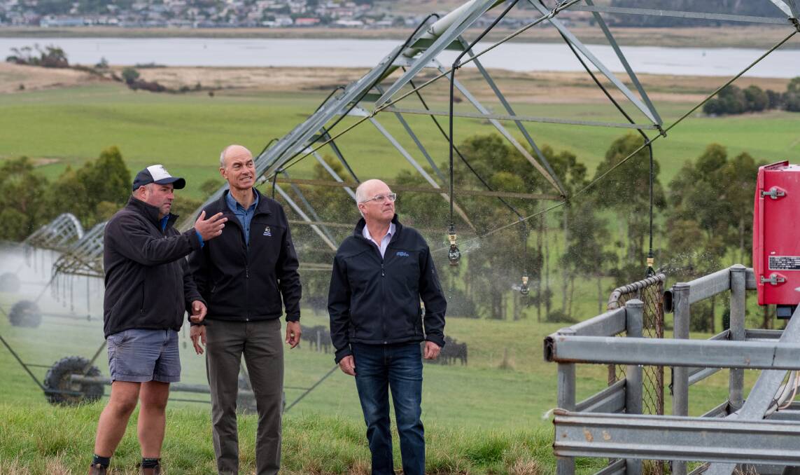 LIQUID GOLD: Landfall Angus co-owner Ed Archer, Primary Industries and Water minister Guy Barnett, and Irrigation Tasmania chief executive Andrew Kneebone at Landfall Angus' East Tamar-based farm on Monday. Picture: Phillip Biggs