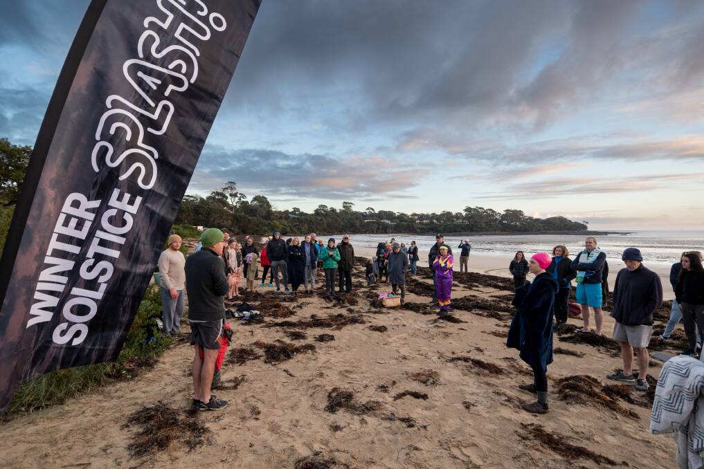 OUT IN FORCE: Loaves and Fishes Tasmania community partnerships manager Paul O' Rourke speaks before the start of the Loaves and Fishes Winter Solstice Splash at Greens Beach on Sunday. Picture: Phillip Biggs