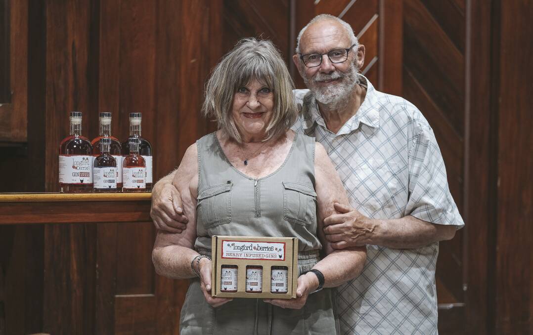 WIN FOR GIN: Owners of Longford Berries Cheryl and Dennis Betts with some of their berry-infused gin at Albert Hall. Picture: Craig George