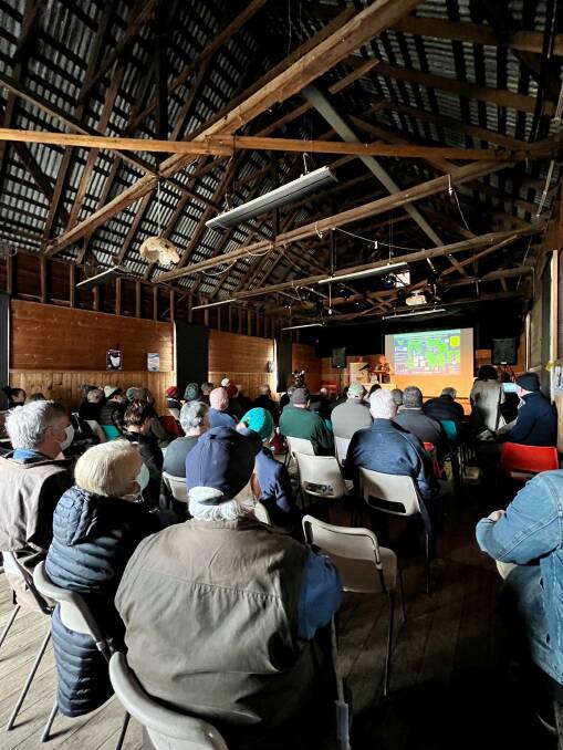 UP-IN-ARMS: Attendees watching a presentation at the public meeting held at the historic Koonya Hall on the Tasman Peninsula yesterday. Picture:Supplied