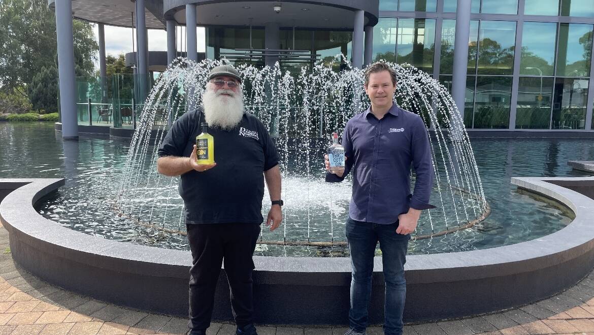 CHEERS: Darby-Norris Distillery Co-founder Jeff Darby and Three Cuts Gin co-founder Justin Turner with their respective gin products, outside of the Country Club Tasmania in anticipation of the Variety of Gins event set to be held there for the second consecutive year. Picture: Luke Miller