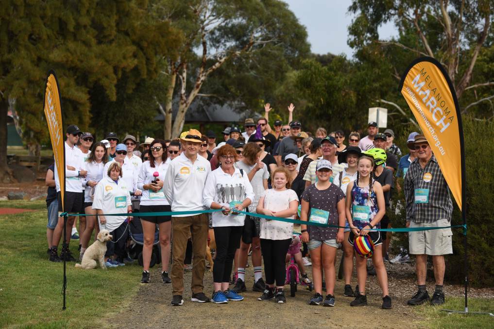 MARCHING AS ONE: Professor Richard Scolyer watches Lizzie May cut the ribbon to start the 2019 March for Melanoma Awareness, in Heritage Forest. Picture: Paul Scambler