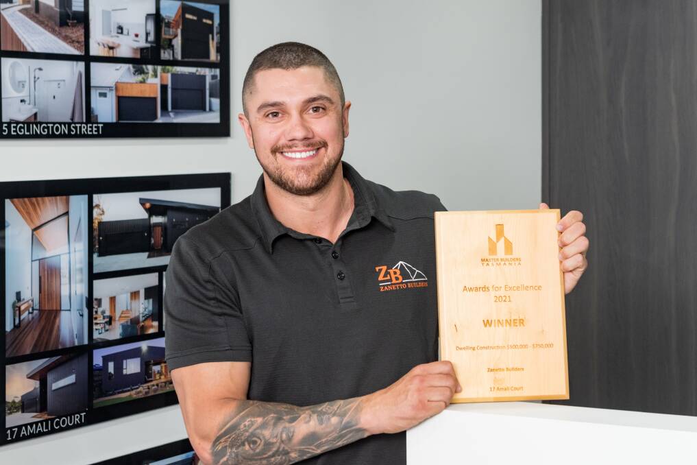 WINNER: Kyle Zanetto holding the award won by Zanetto Builders at the Master Builders Awards for Excellence event. Picture: Phillip Biggs
