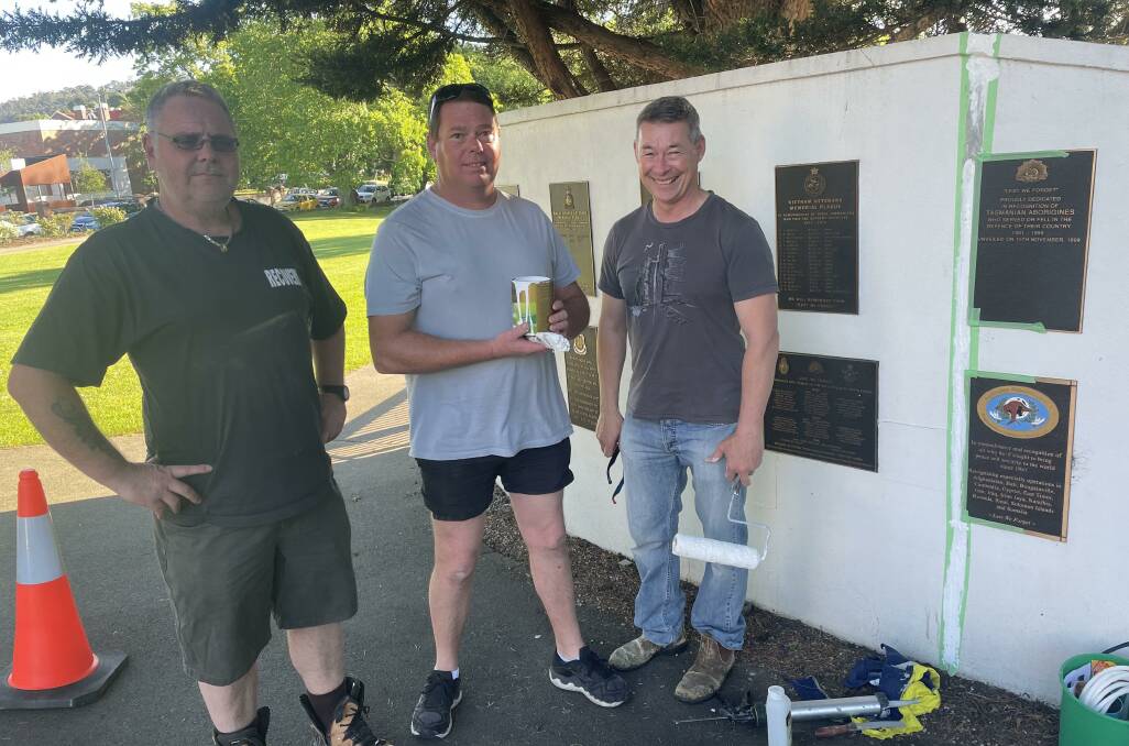 FROM DIGGERS TO PAINTERS: Mark Anderson, James Worley and David McIntee at the Memorial Wall. Picture: Joshua Peach 