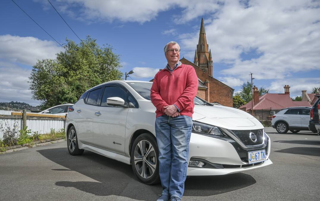 GOING ELECTRIC: Pastor Jeff McKinnon with his electric vehicle. Picture: Craig George