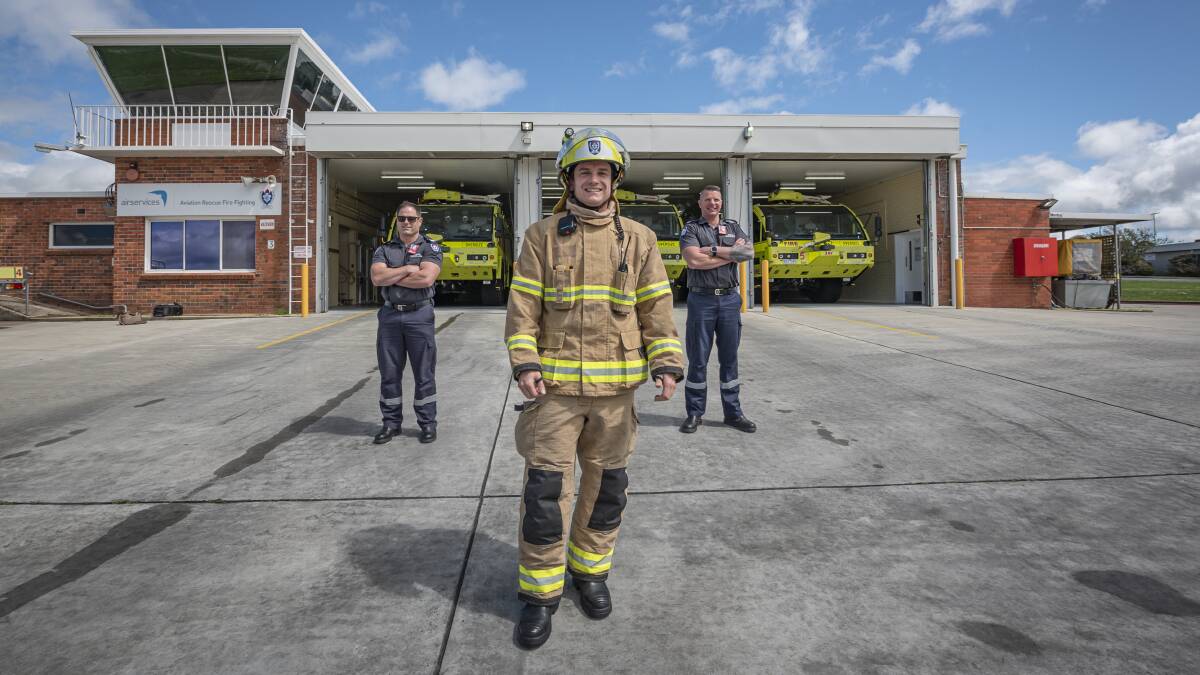 FIRE DRILL: Ben Kettle Leading Fire Fighter, Amos Scull Leading Fire Fighter and Brad Wright Sub Station Offcer preparing for Airport Safety Week at Launceston Airport. Picture: Craig George