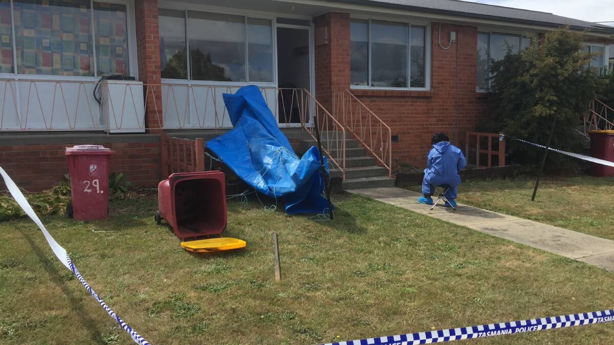 Police collecting forensic evidence outside Sammual Wilmot's Waverley unit in 2018