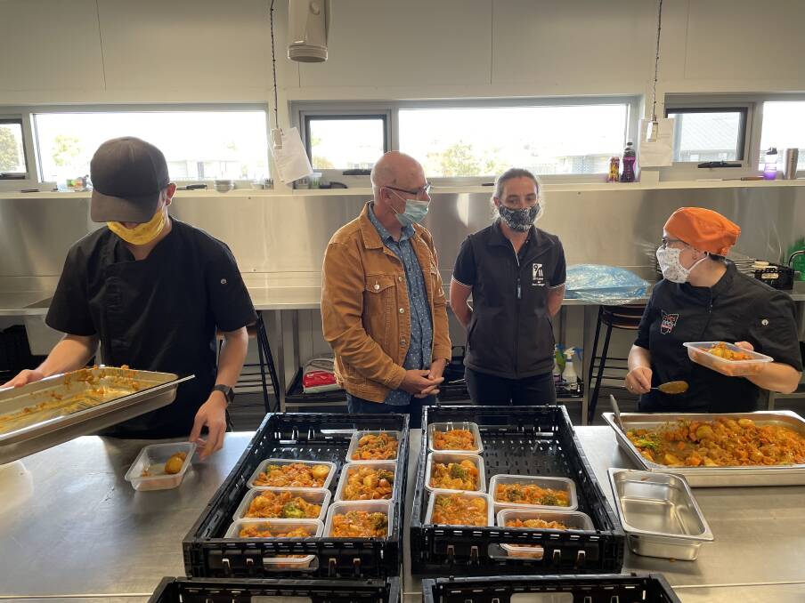Good Drop: Paul O'Rourke and Mel Cox with Loaves and Fishes chefs preparing meals for disadvantaged Tasmanians. Picture: Simon McGuire