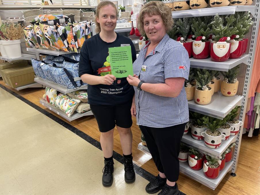 Christmas Cheer: Sharon Reynolds and Linda Laycock from Kmart Burnie, who process the laybys that were cleared by an anonymous hero. Picture: Simon McGuire