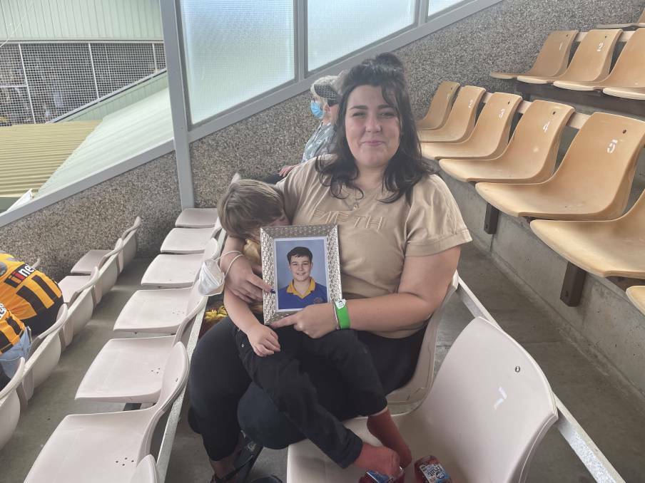 Georgie Burt with a picture of her son Zane Mellor at the Hillcrest AFL tribute match earlier this year held in honour of the victims of the tragedy. File picture.