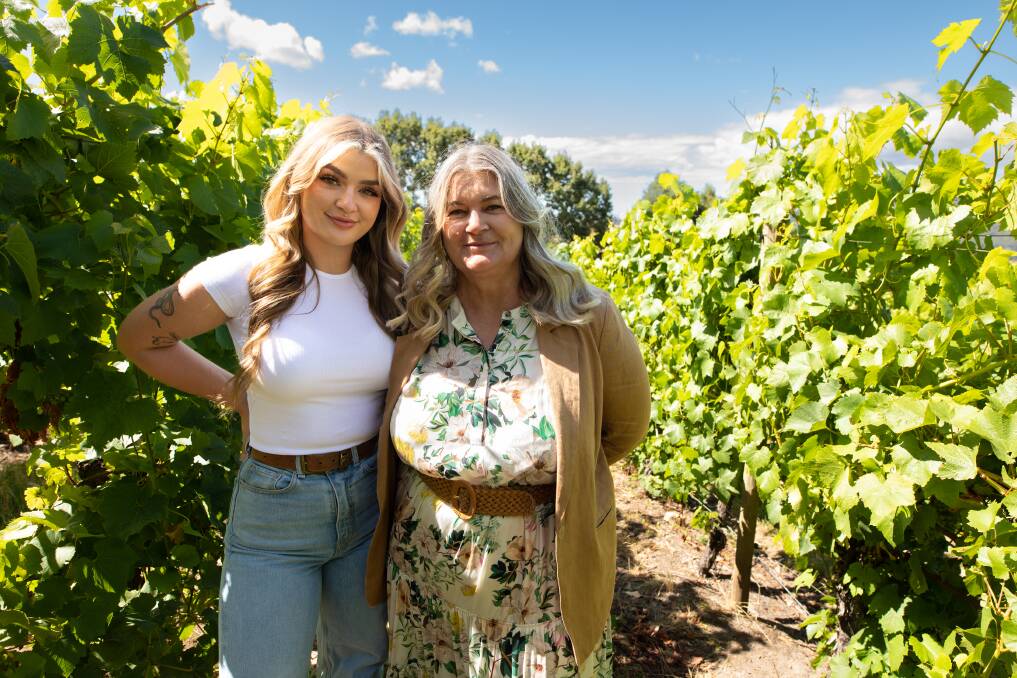 Coral Hargrave with her daughter Savannah at their new vineyard at Lower Barrington. Picture by Eve Woodhouse