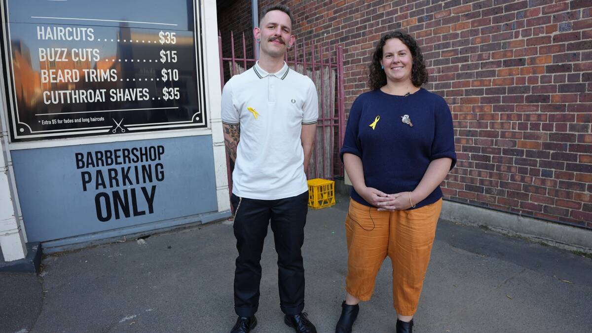 SUICIDE PREVENTION: Barber Sidney Davies and Launceston Suicide Prevention Coordinator Stephanie Armour talk mental health first aid. Picture: Supplied