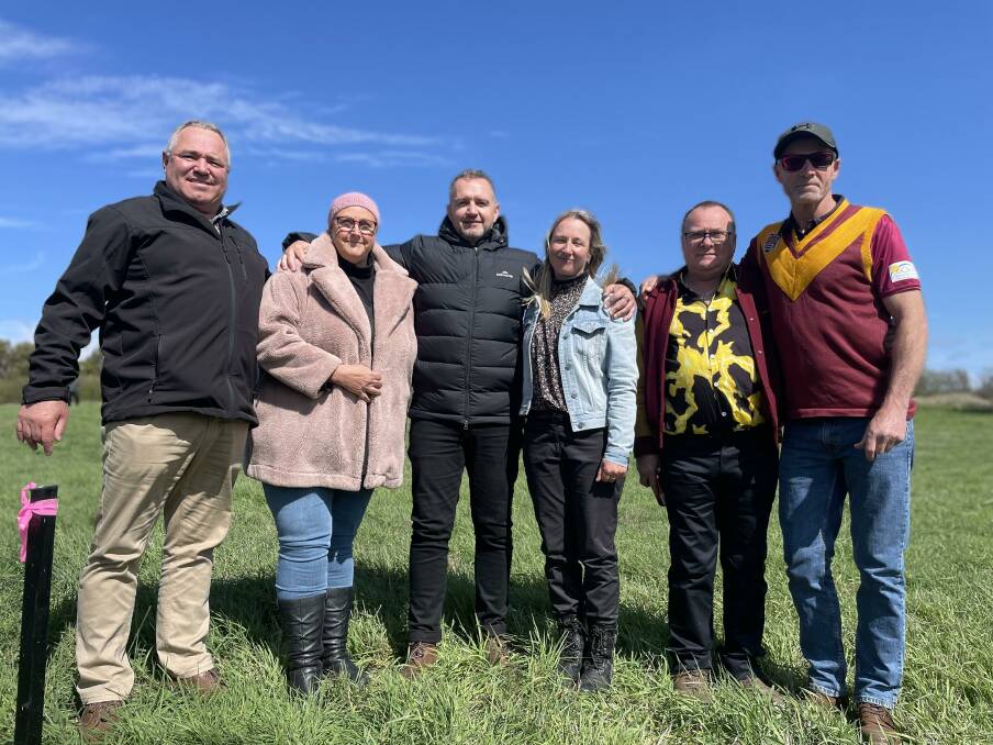 Murray Collard of Lyndale Football Club, Dianne Rigby, Scott Blakely, Ragan Allison, Ken Stewart and Terry King at the stake marking the final resting place of the plane. Picture supplied