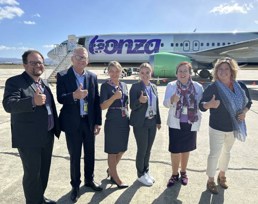 Stakeholders including Launceston Airport chief executive Shane O'Hare and Visit Northern Tasmania chief executive Tracey Mallett to celebrate Bonza adding direct flights to Queensland's Sunshine Coast to its network. Picture supplied