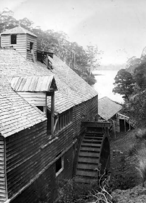 This side view c1890 by photographer HJ King shows a big iron overshot waterwheel at the rear. It was installed in 1855 when extra millstones were added. Picture by QVMAG