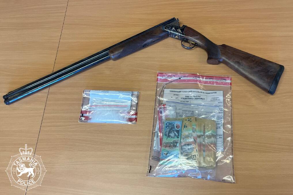Police say a stolen shotgun, nearly $35,000 in cash and the drug ice were found after a raid at Summerhill. Picture by Tasmania Police