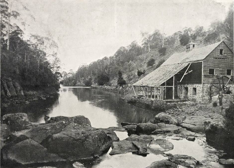In 1906, when this image was taken, the mill was falling apart, and the outbuildings were
gone. The location of the original 18-foot timber overshot waterwheel can be seen. Picture by The Weekly Courier