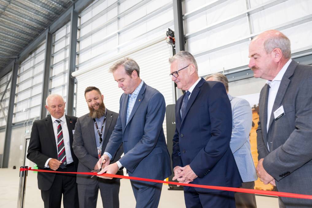 Chairman of Australia Pacific Airports (Launceston) Hugh McKenzie, Virgin Australia cargo operations manager Fin Blyth, Transport Minister Michael Ferguson, Launceston CEO Shane O'Hare, Member for Bass Simon Wood and Liberal Member for Lyons Mark Shelton cut a ribbon to official open the cargo facility. Picture by Phillip Biggs